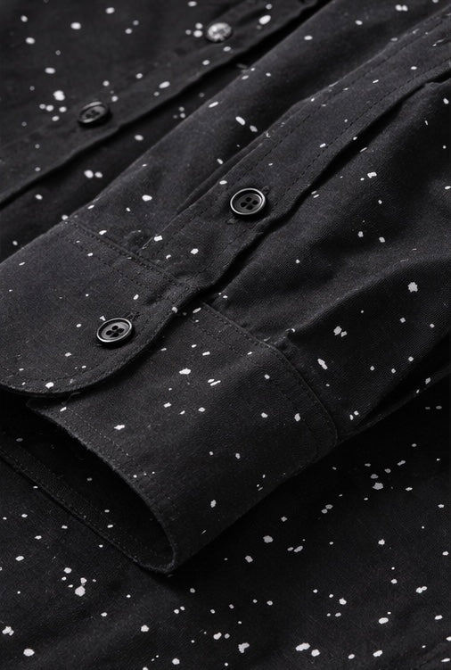 Dior featuring a speckled pattern and a white embroidered phrase on the pocket.